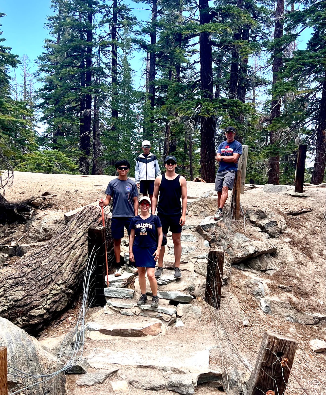Veronica hiking with her family on a forest trail