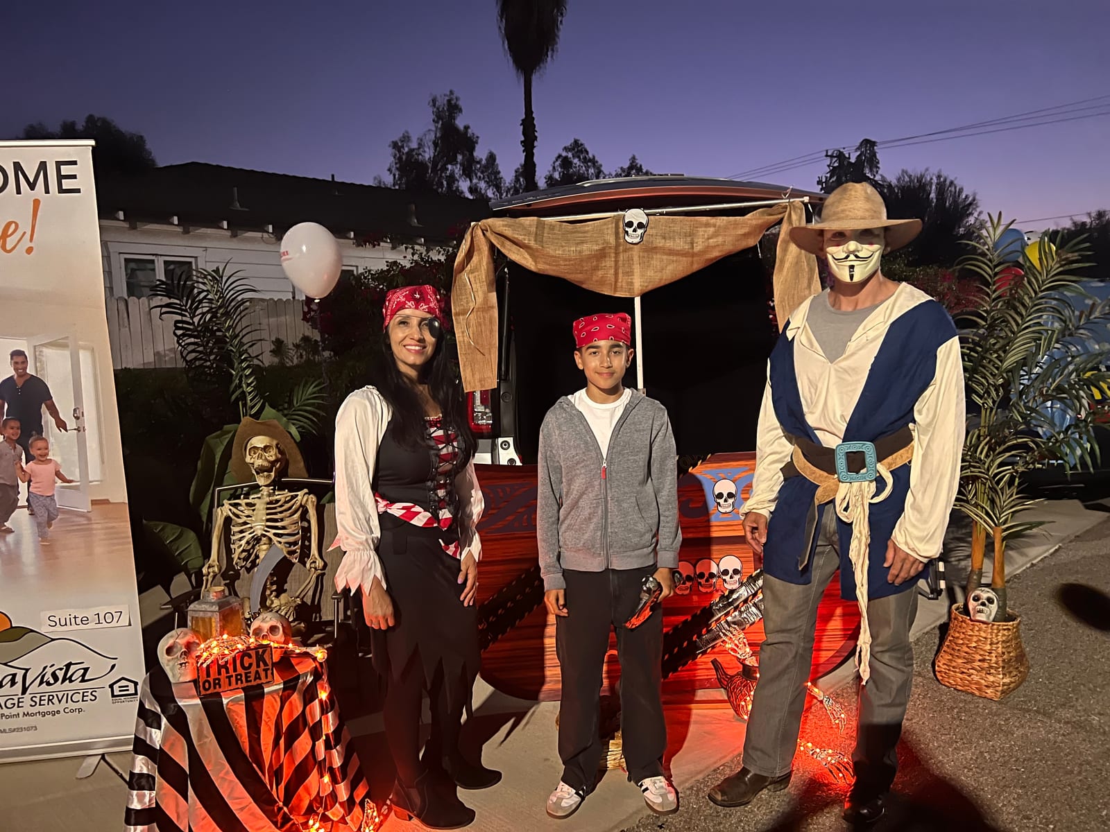 Veronica in a pirate costume at a community trunk-or-treat event